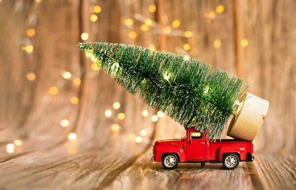 miniature-red-car-on-a-wooden-background-with-chri-2024-11-27-10-28-15-utc